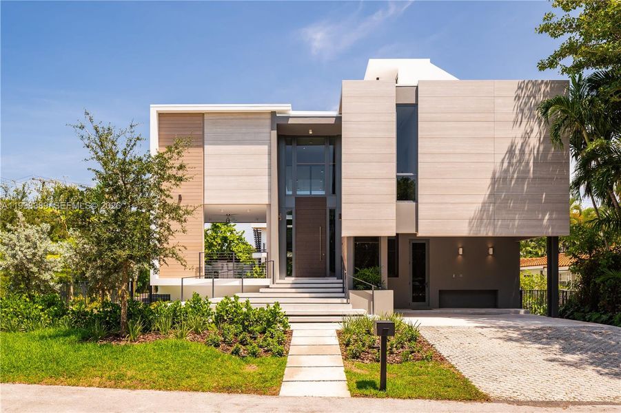 Front exterior of a new home in , Key Biscayne, FL, highlighting curb appeal (Image 13).