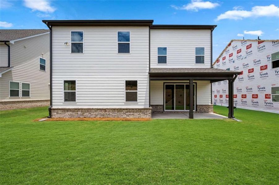 Exterior details and patio area of a home in The Paddocks at Doc Hughes, Buford (Image 4).