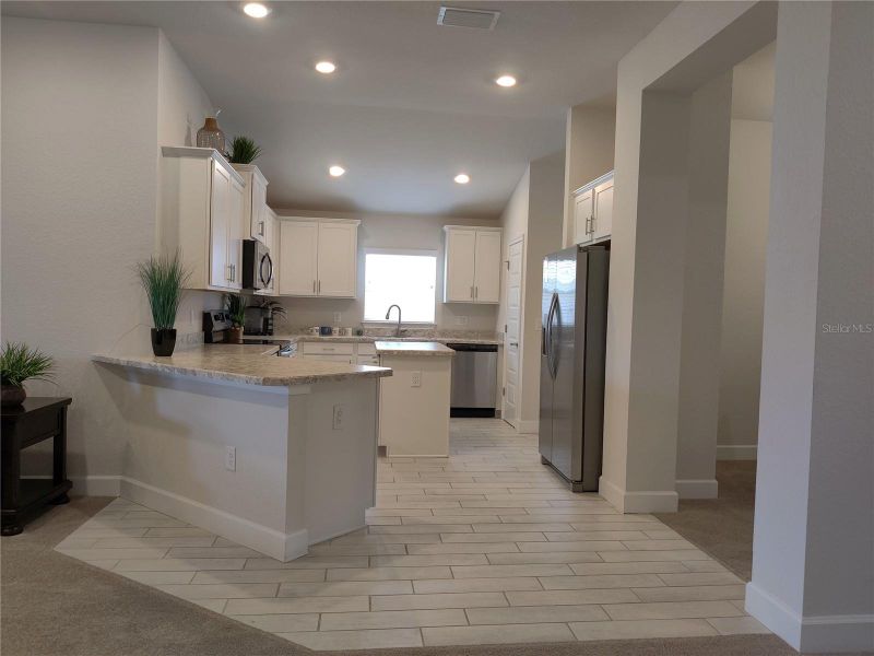 Furnished interior view inside a new home in Sunset Landing, Spring Hill (Image 9).