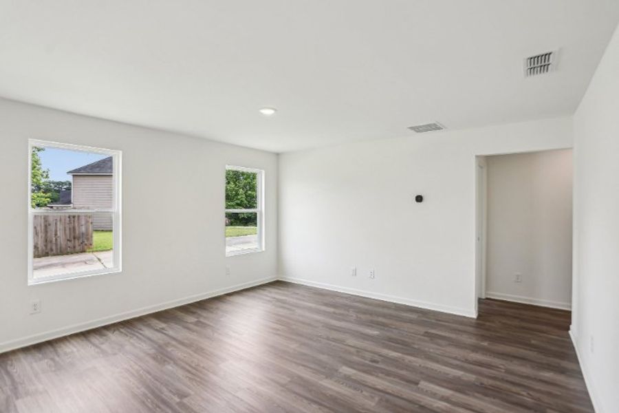 A room with a wood floor and a wood floor.