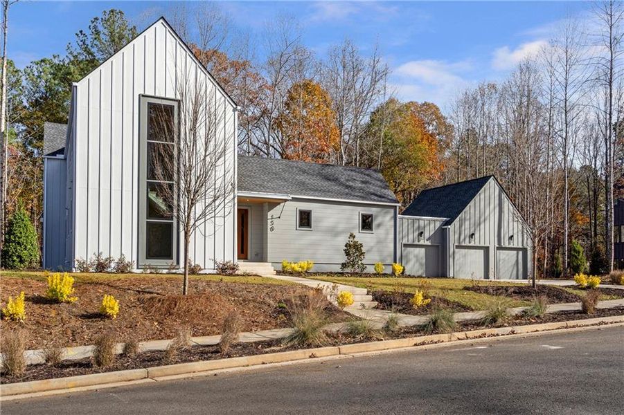 Front exterior of a new home in Aster, Roswell, GA, highlighting curb appeal (Image 27). Front exterior of a new home in Aster, Roswell, GA, highlighting curb appeal (Image 27).