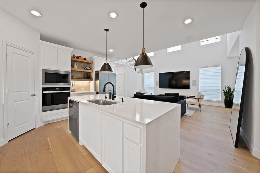 Modern kitchen island with a built-in sink and integrated dishwasher