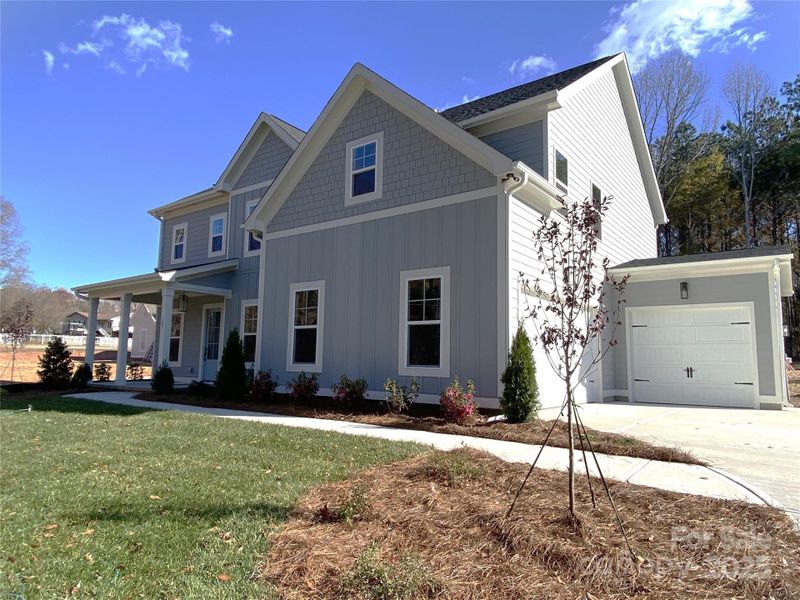 Front exterior of a new home in , Mooresville, NC, highlighting curb appeal (Image 2).