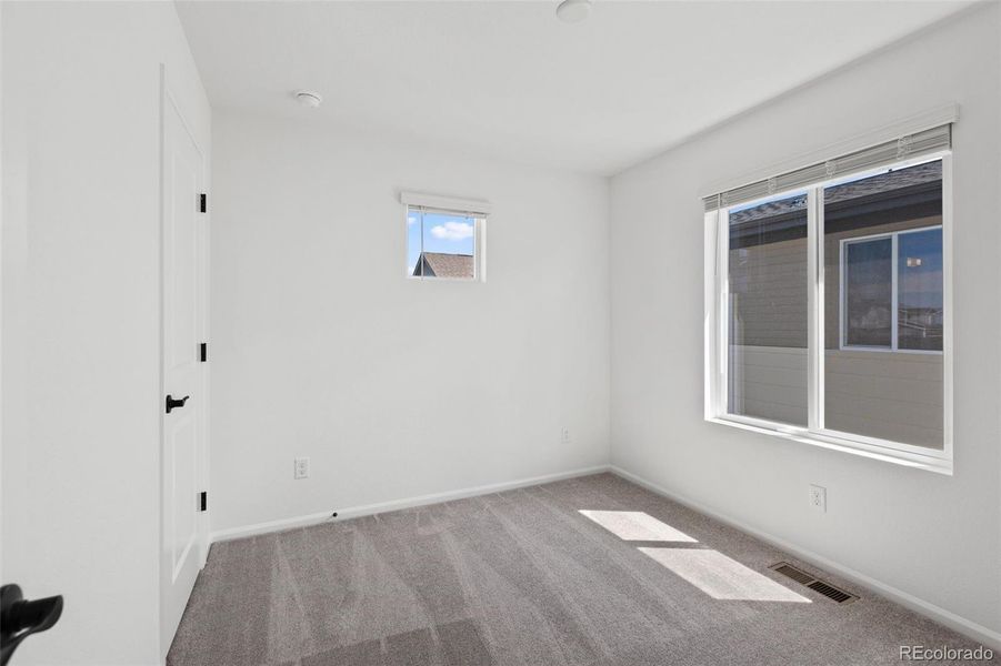 Spacious, unfurnished interior of a new home in Woodrose at Painted Prairie, Aurora (Image 13).