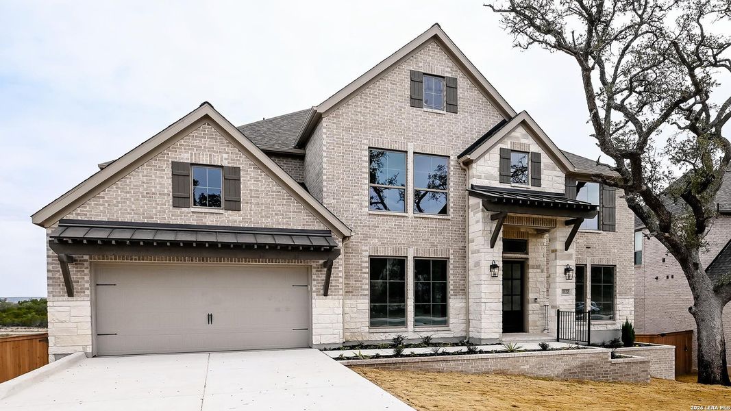 Front exterior of a new home in Johnson Ranch, Bulverde, TX, highlighting curb appeal (Image 2). Front exterior of a new home in Johnson Ranch, Bulverde, TX, highlighting curb appeal (Image 2).