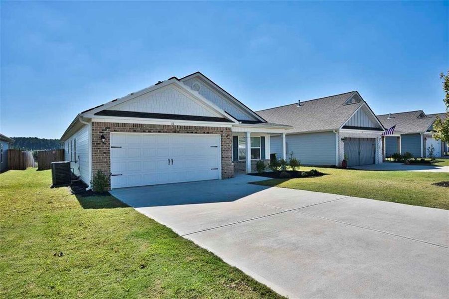 Front exterior of a new home in , Winder, GA, highlighting curb appeal (Image 2). Front exterior of a new home in , Winder, GA, highlighting curb appeal (Image 2).