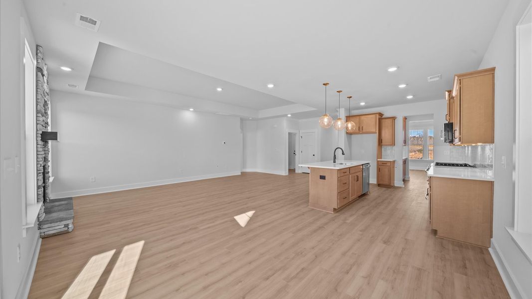 Superior design shines in this open-concept family room with timeless finishes and a modern edge