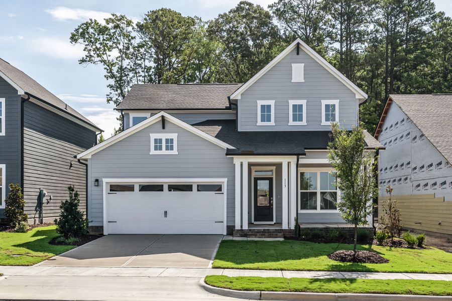 Front exterior of a new home in Serenity - The Village Collection, Fuquay Varina, NC, highlighting curb appeal (Image 1). Front exterior of a new home in Serenity - The Village Collection, Fuquay Varina, NC, highlighting curb appeal (Image 1).