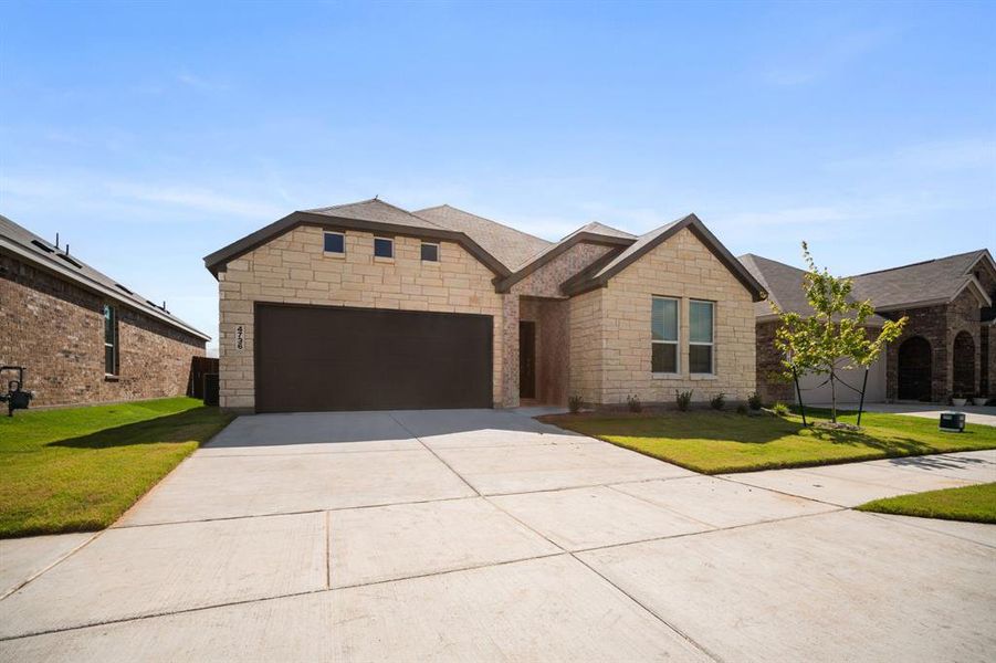 Front exterior of a new home in Prairie View, Ennis, TX, highlighting curb appeal (Image 2). Front exterior of a new home in Prairie View, Ennis, TX, highlighting curb appeal (Image 2).