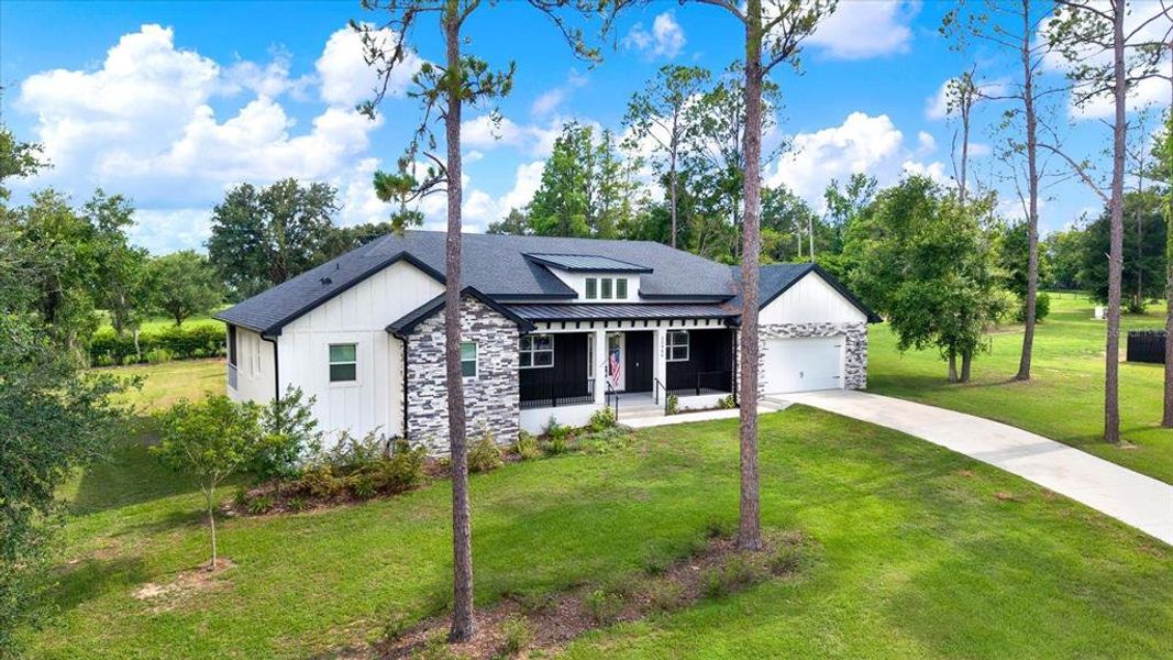 Front exterior of a new home in , Dade City, FL, highlighting curb appeal (Image 1). Front exterior of a new home in , Dade City, FL, highlighting curb appeal (Image 1).