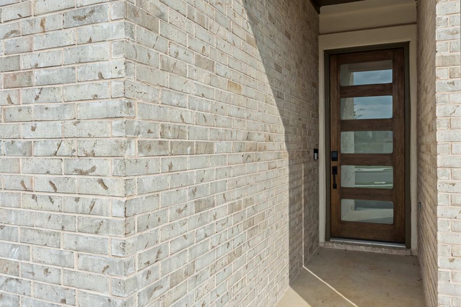 Exterior details and patio area of a home in Lariat, Liberty Hill (Image 4).