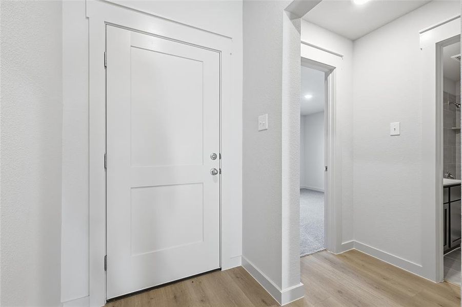 Foyer entrance featuring light wood-style flooring and recessed lighting
