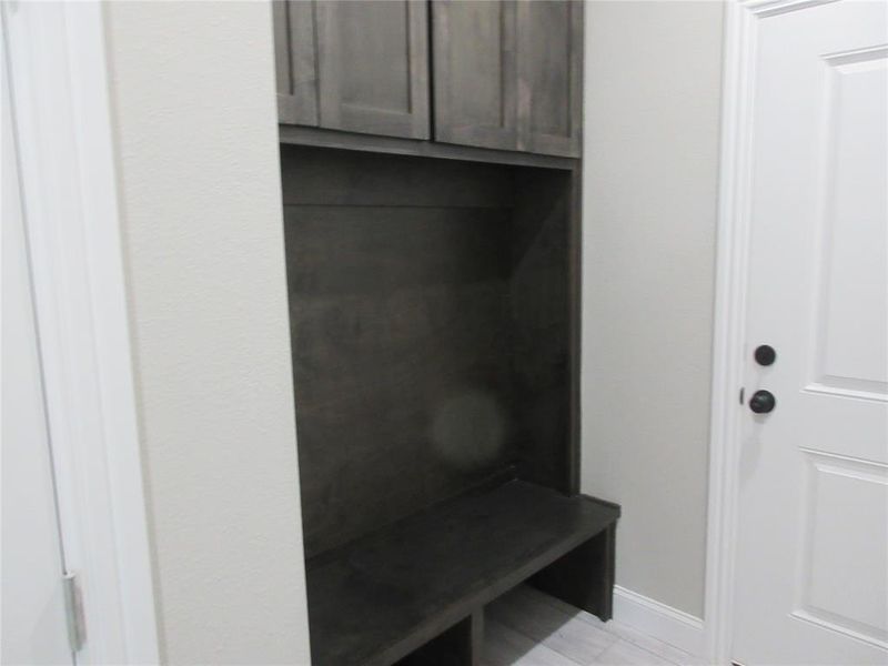 Mudroom with light wood-type flooring