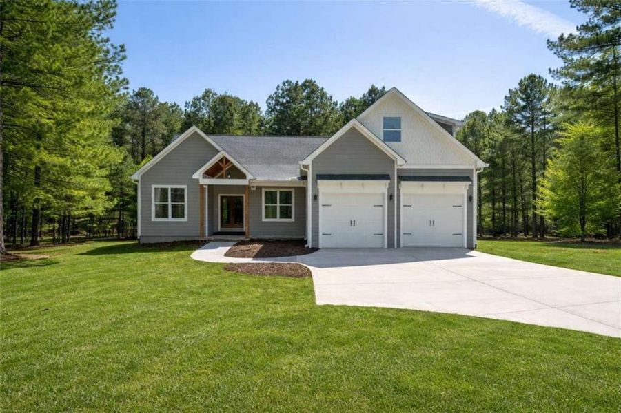 Front exterior of a new home in , Silver Creek, GA, highlighting curb appeal (Image 2). Front exterior of a new home in , Silver Creek, GA, highlighting curb appeal (Image 2).