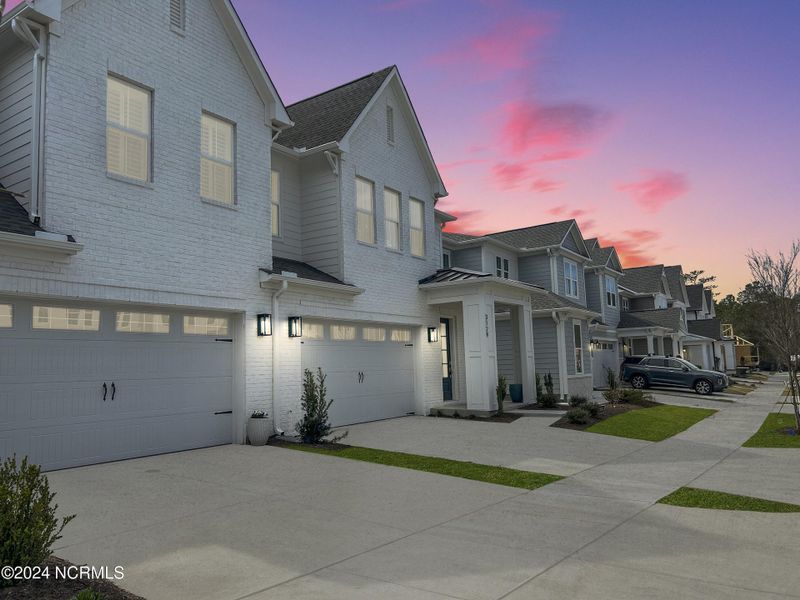 Front exterior of a new home in East & Mason, Wilmington, NC, highlighting curb appeal (Image 27). Front exterior of a new home in East & Mason, Wilmington, NC, highlighting curb appeal (Image 27).