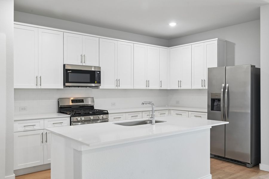 Kitchen in the Hayden home plan by Trophy Signature Homes