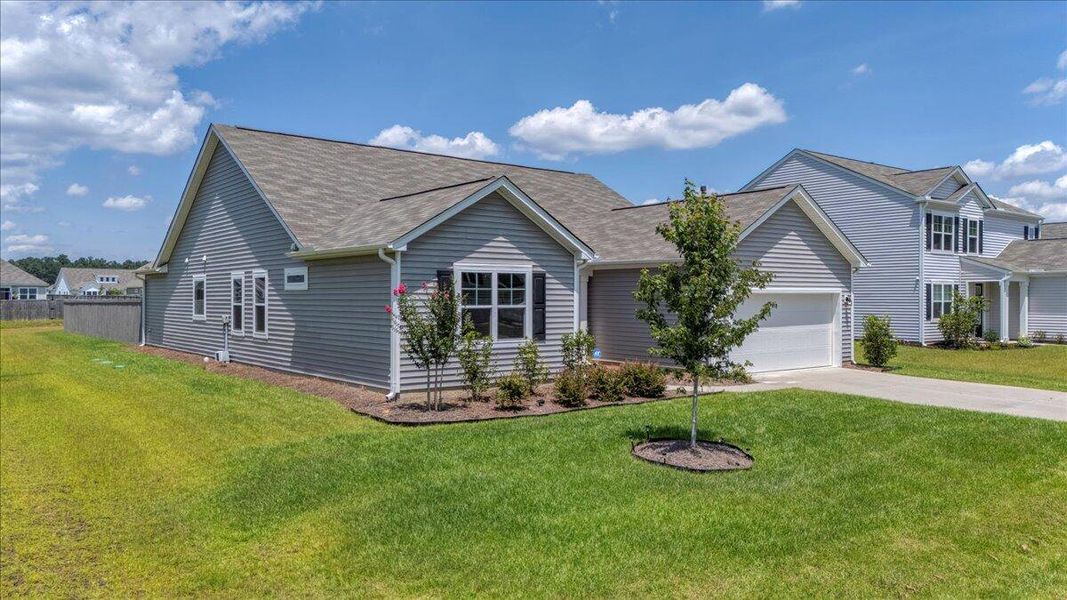 Front exterior of a new home in French Quarter Creek, Huger, SC, highlighting curb appeal (Image 22).