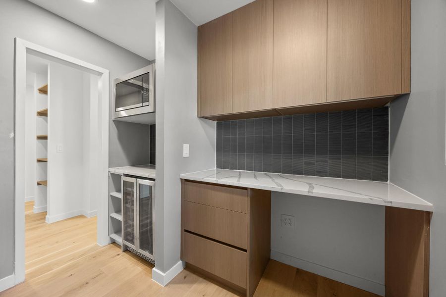 Walk in butlers pantry with extra counter space, wine fridge and microwave Walk in butlers pantry with extra counter space, wine fridge and microwave