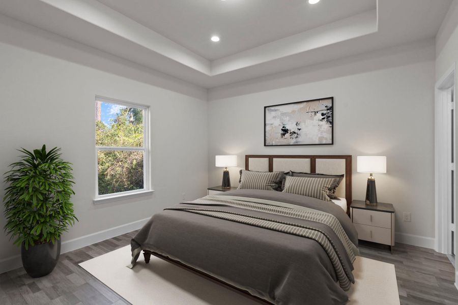 Virtually Staged: Unwind in this master bedroom that features vinyl floors, a tray ceiling, recessed lighting, an en-suite bath. This room is built for elegance and comfort.