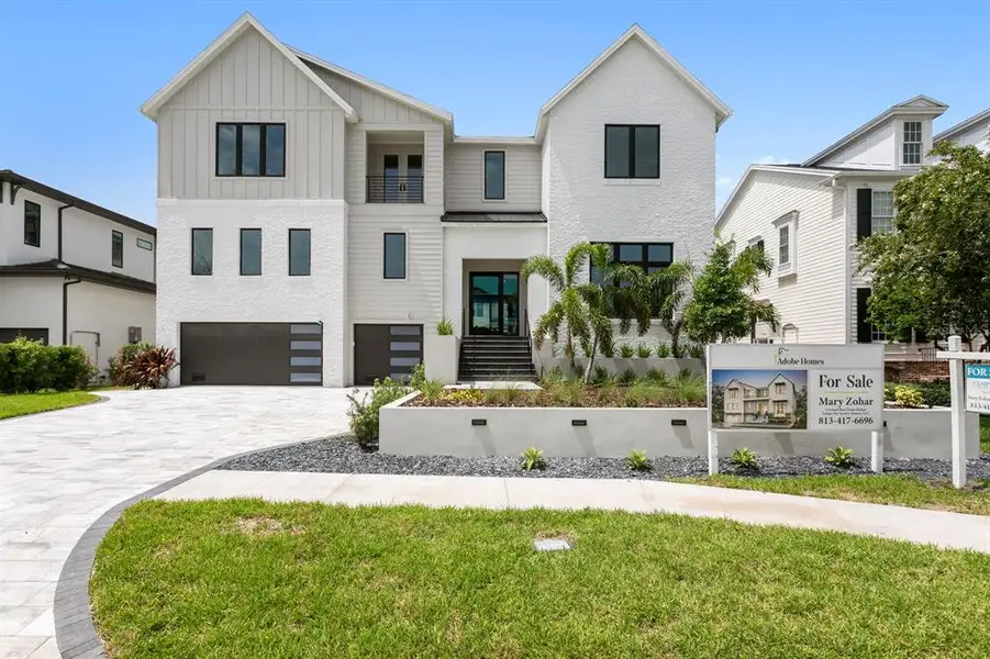 Front exterior of a new home in , Tampa, FL, highlighting curb appeal (Image 29).