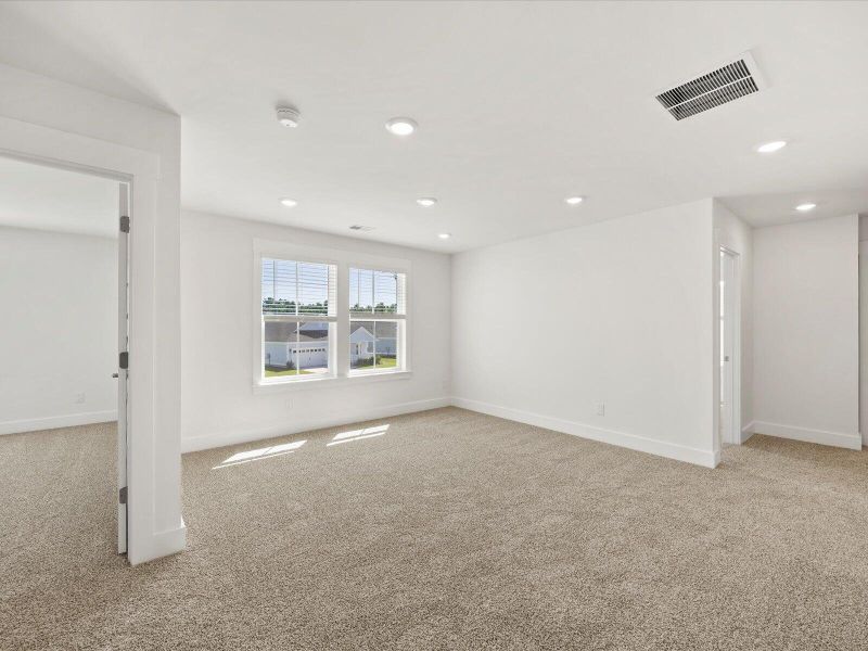 Spacious, unfurnished interior of a new home in The Coves at Lakes of Cane Bay, Summerville (Image 14). Spacious, unfurnished interior of a new home in The Coves at Lakes of Cane Bay, Summerville (Image 14).