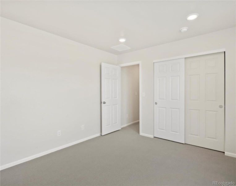 Spacious, unfurnished interior of a new home in Buffalo Highlands: The Flora Collection, Commerce City (Image 21).