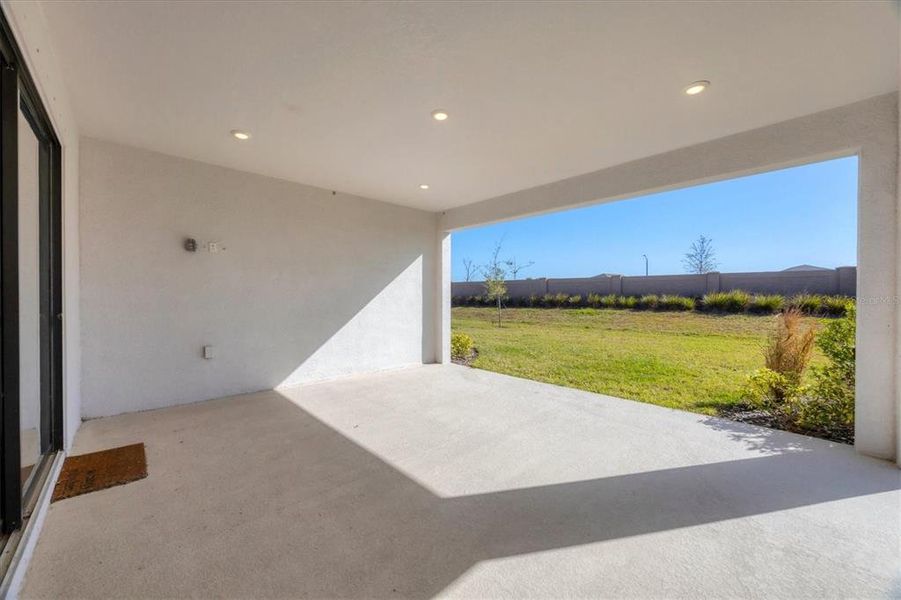 Exterior details and patio area of a home in Esplanade at Artisan Lakes, Palmetto (Image 25).