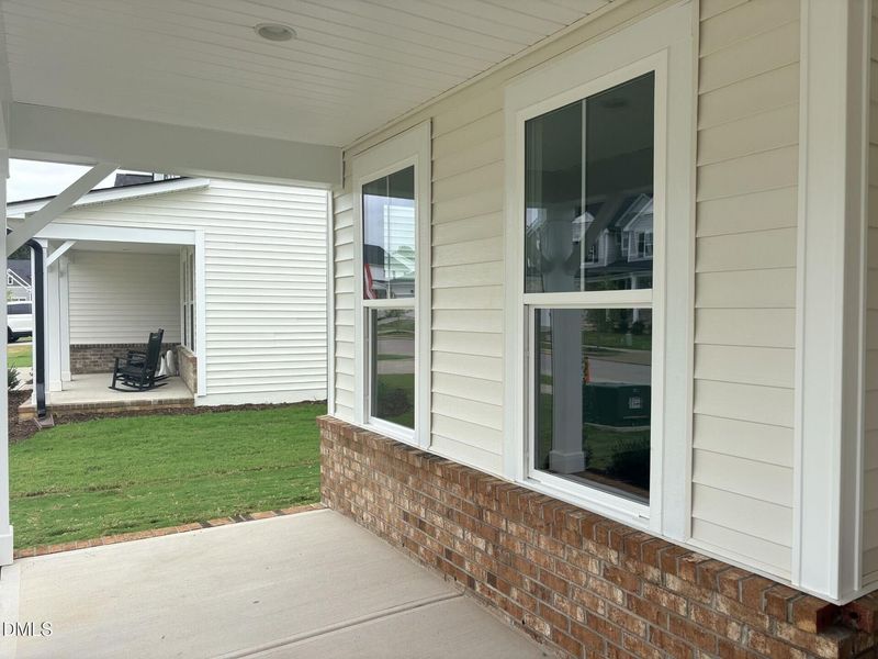 Exterior details and patio area of a home in Woodland Crossing, Zebulon (Image 3).