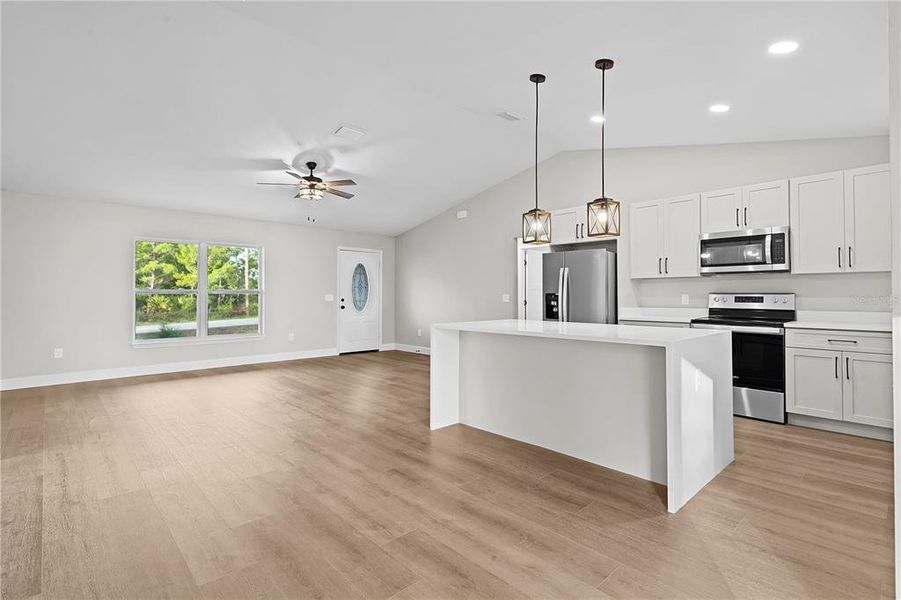 Kitchen island with quartz waterfall countertops