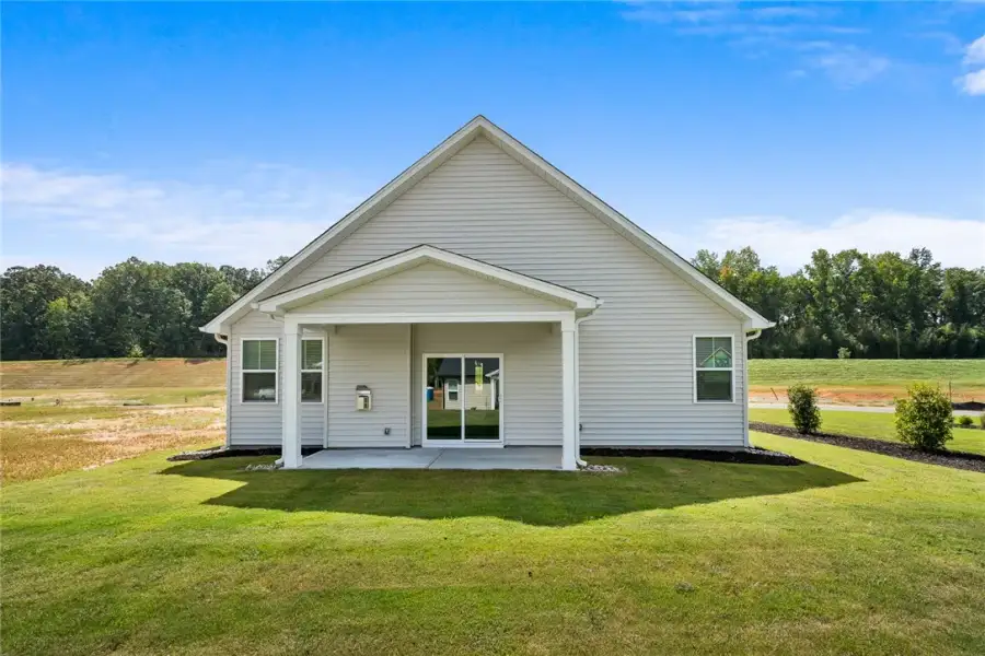 A covered back porch offers a peaceful outdoor ret A covered back porch offers a peaceful outdoor ret
