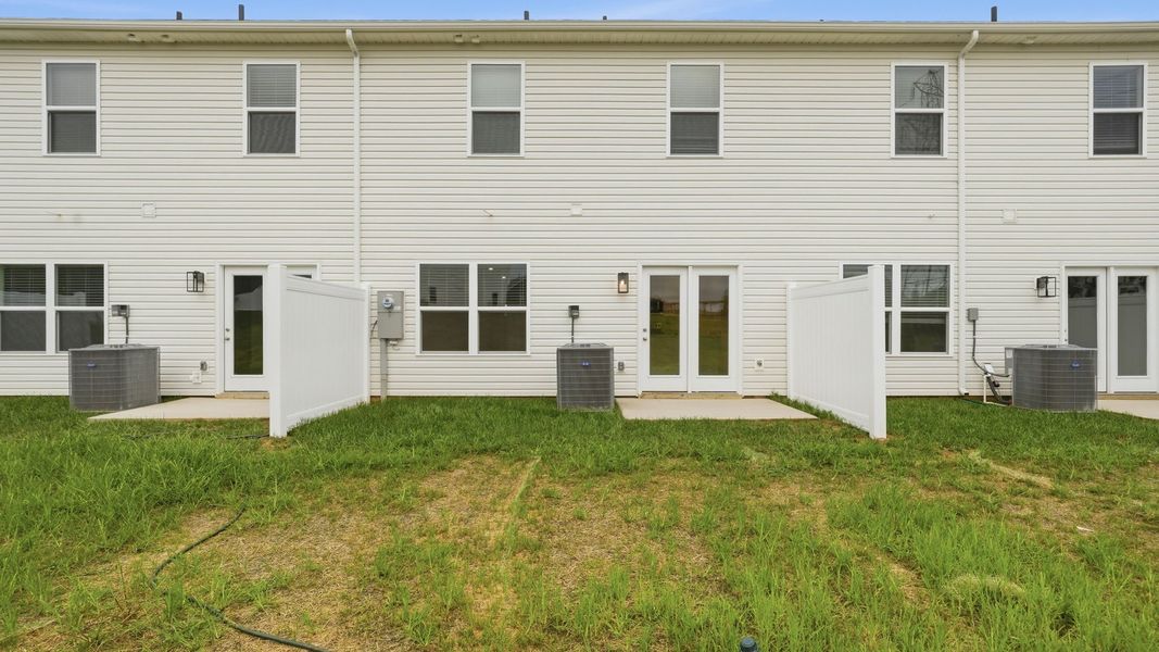 Exterior details and patio area of a home in Fieldcrest Acres Townhomes, Blountville (Image 4).