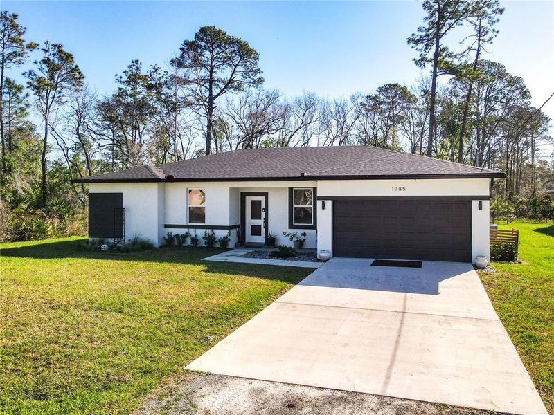 Front exterior of a new home in , Deland, FL, highlighting curb appeal (Image 21).