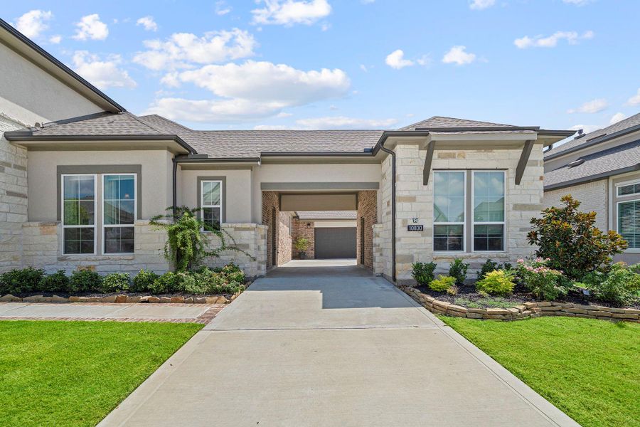 Front exterior of a new home in Bridgeland 80′, Cypress, TX, highlighting curb appeal (Image 2). Front exterior of a new home in Bridgeland 80′, Cypress, TX, highlighting curb appeal (Image 2).