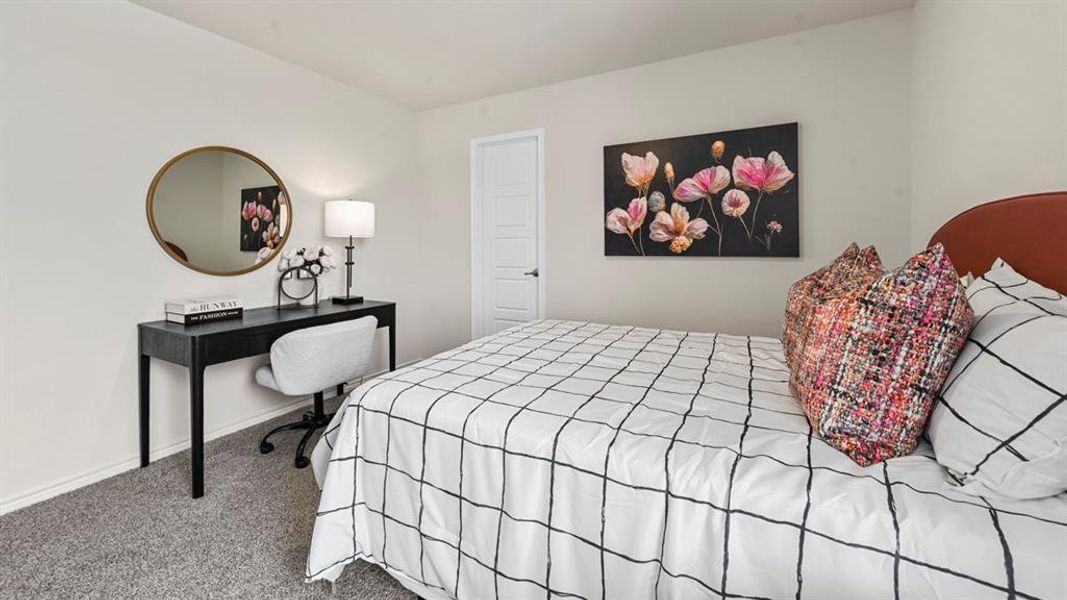 Carpeted bedroom with baseboards Carpeted bedroom with baseboards