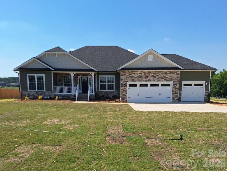 Front exterior of a new home in Swann Hills, Statesville, NC, highlighting curb appeal (Image 1). Front exterior of a new home in Swann Hills, Statesville, NC, highlighting curb appeal (Image 1).