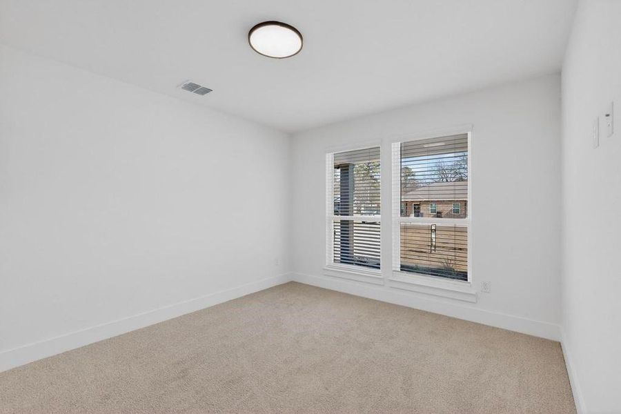 Bedroom/Office room featuring carpet and baseboards