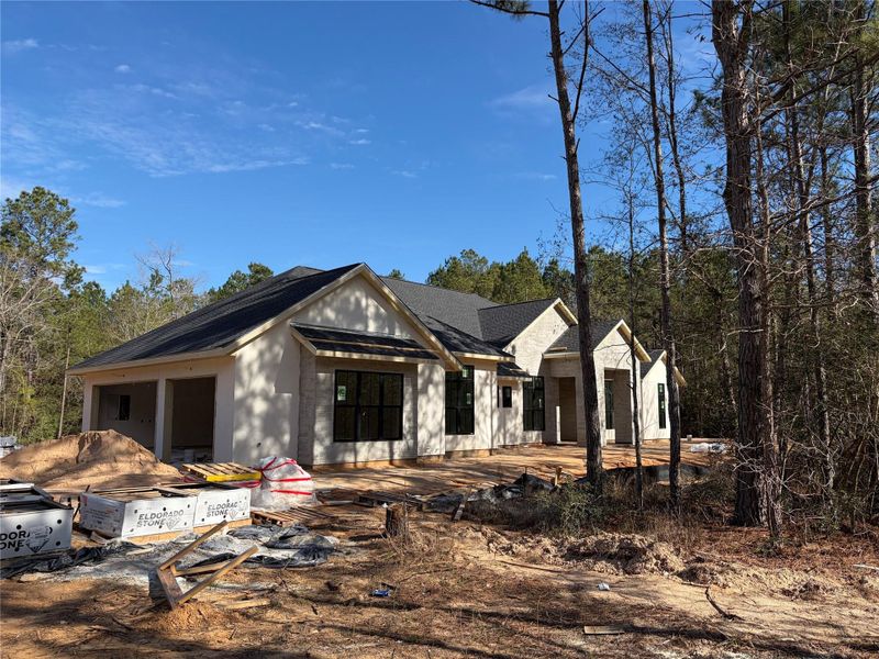 Sprawling one story custom Grayton with oversized 3 car side load garage