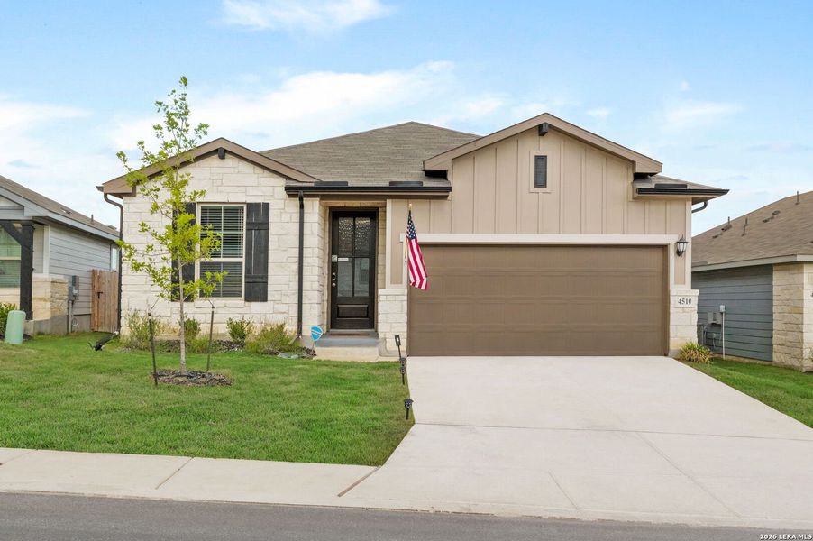 Front exterior of a new home in Remington Ranch, San Antonio, TX, highlighting curb appeal (Image 2). Front exterior of a new home in Remington Ranch, San Antonio, TX, highlighting curb appeal (Image 2).