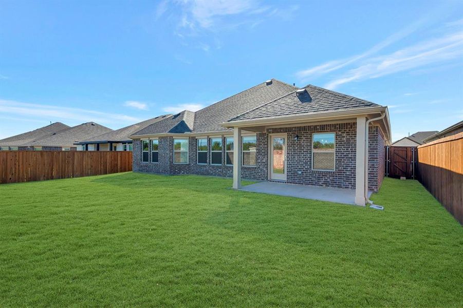 Exterior details and patio area of a home in The Preserve, Justin (Image 22).