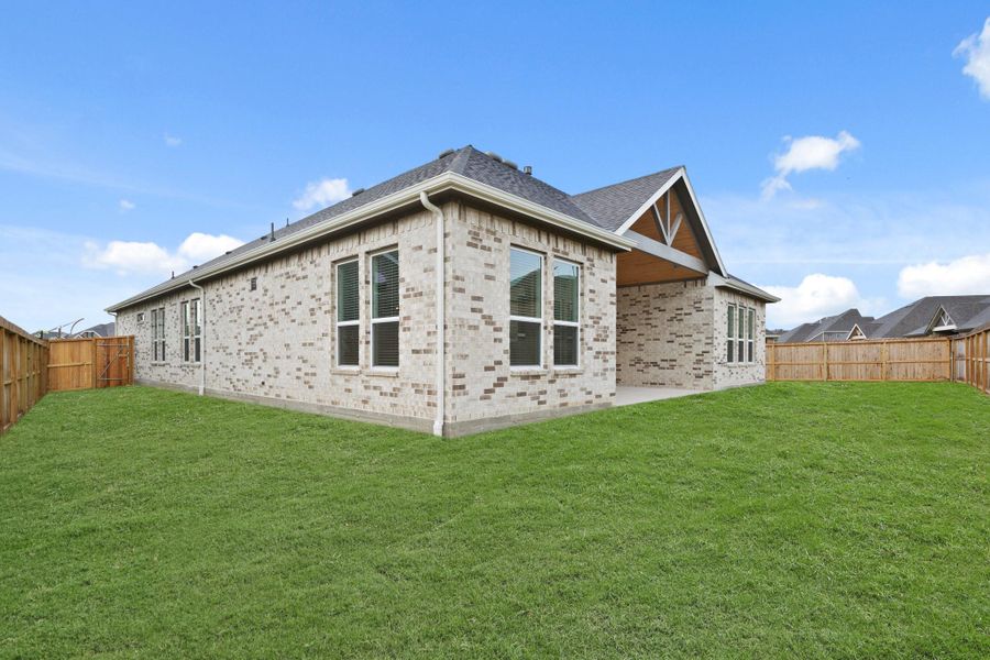 Exterior details and patio area of a home in Westland Ranch - 70' Homesites, League City (Image 2).