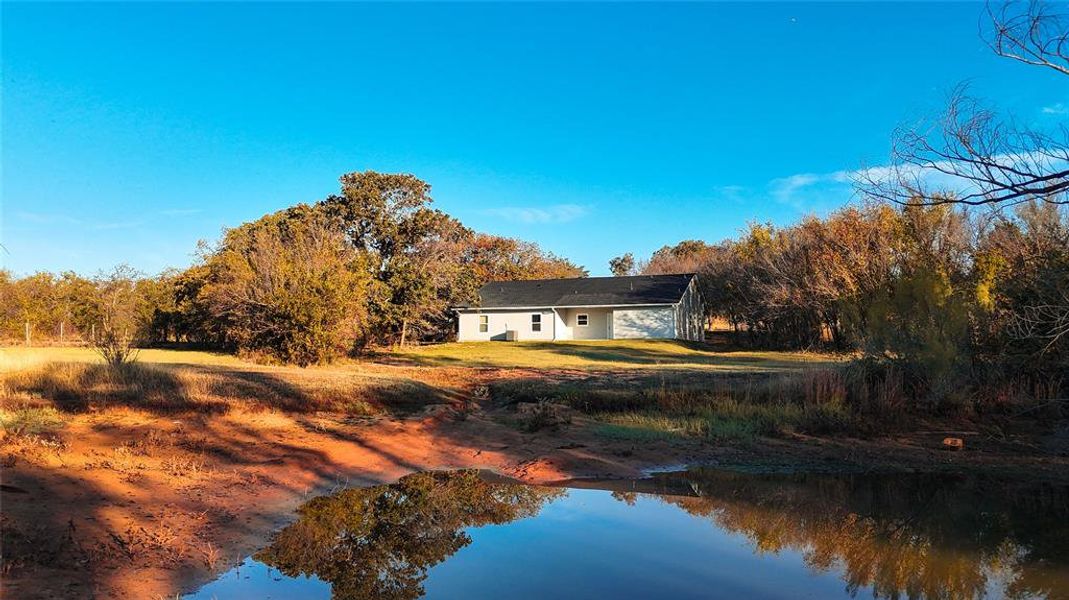 Rear view of house with a water view