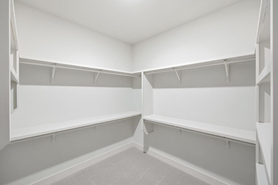 Walk in closet attached to primary bathroom