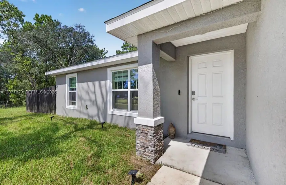 Exterior details and patio area of a home in , Citrus Springs (Image 20).