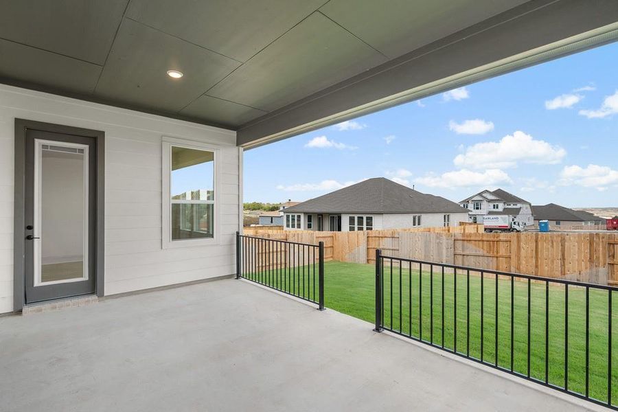 Exterior details and patio area of a home in Lariat, Liberty Hill (Image 24).