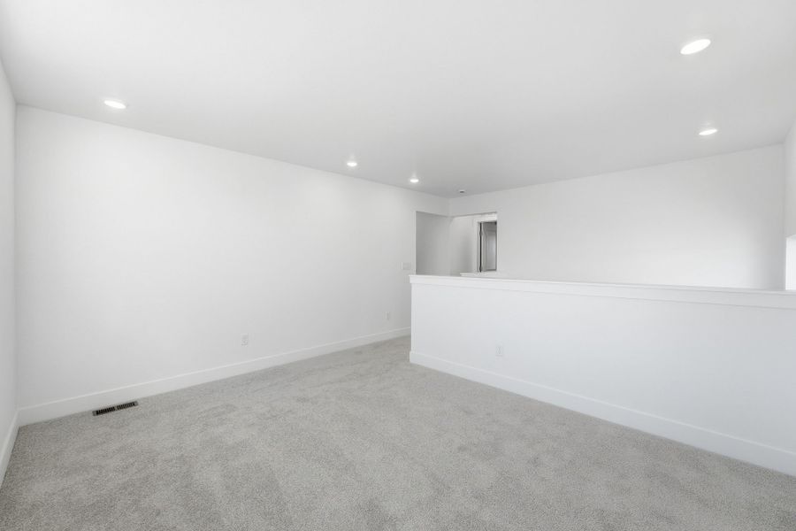 Spacious, unfurnished interior of a new home in Trailstone, Arvada (Image 13).