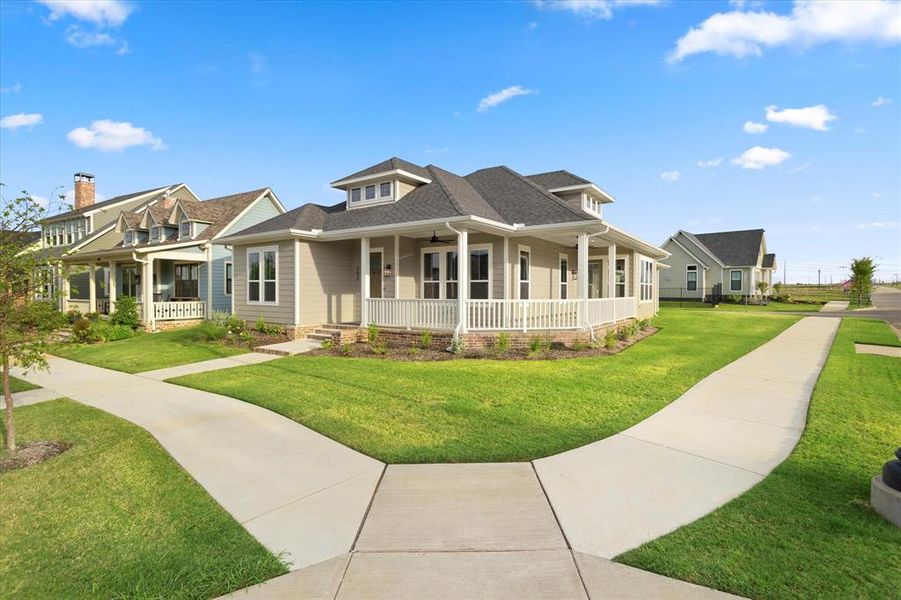 View of front facade with a porch and a front lawn