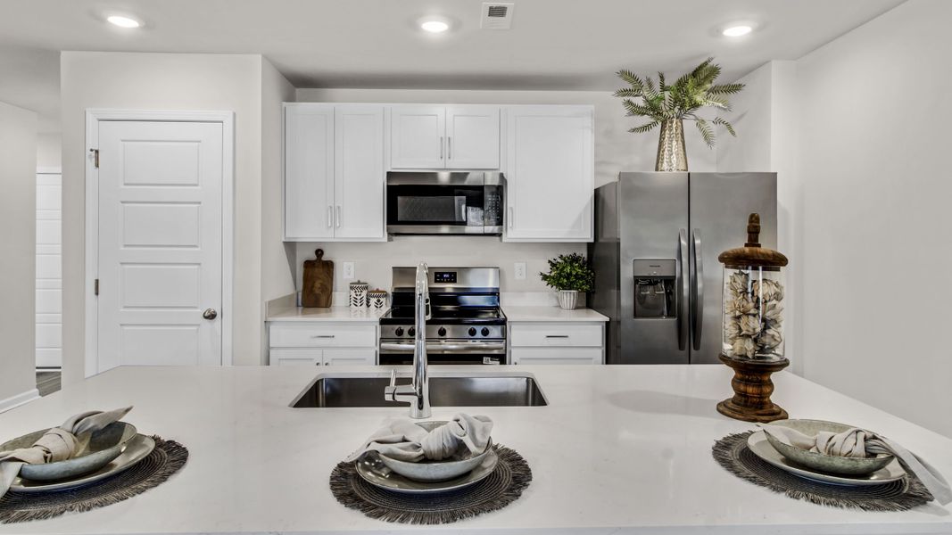 Representative furnished interior of a home built from the Freeport by D.R. Horton in Bailey Park, Fayetteville (Image 18).