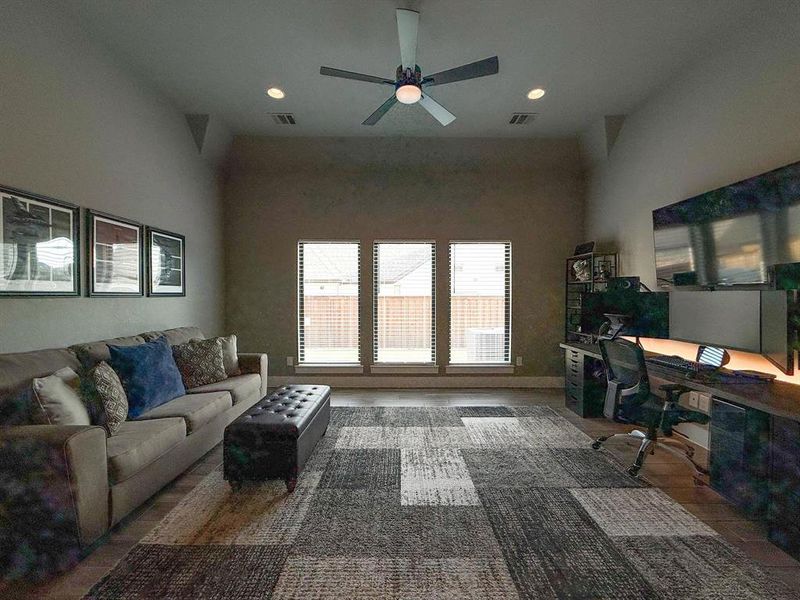 Living room featuring an office area, wood finished floors, recessed lighting, and a ceiling fan Living room featuring an office area, wood finished floors, recessed lighting, and a ceiling fan