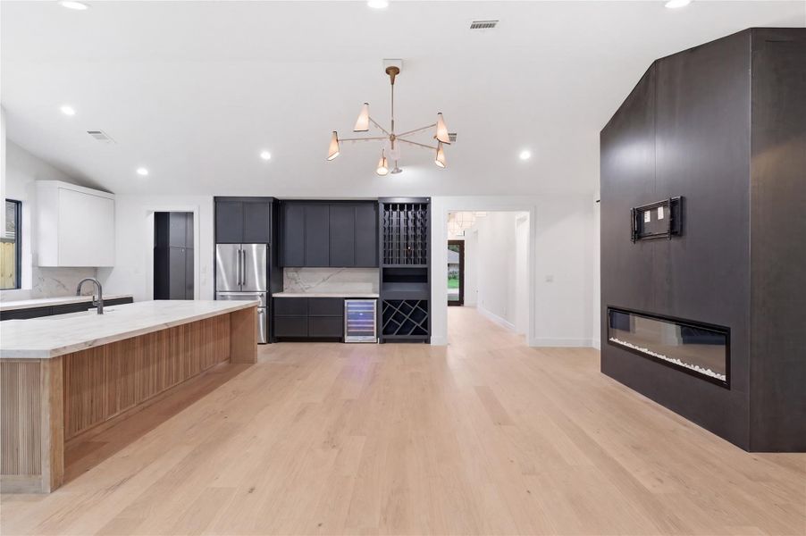 The heart of the home, this stunning kitchen showcases a spacious oversized island, premium finishes, and exceptional functionality.