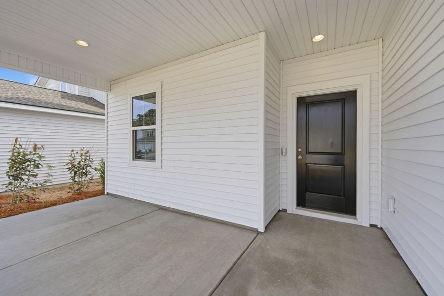Exterior details and patio area of a home in Grand Arbor, Blythewood (Image 19).